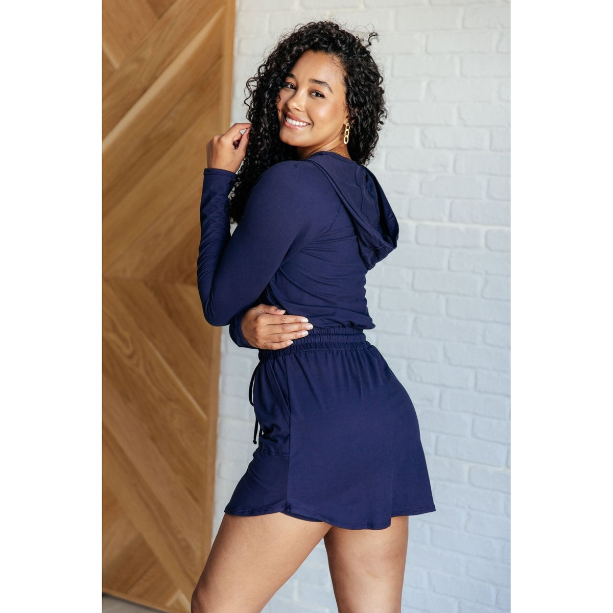 Getting Out Long Sleeve Hoodie Romper in Navy